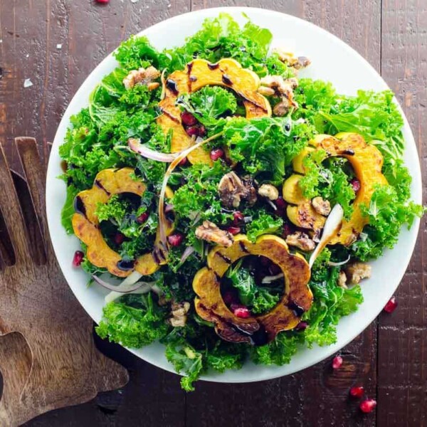 fall kale salad with delicata squash on a plate