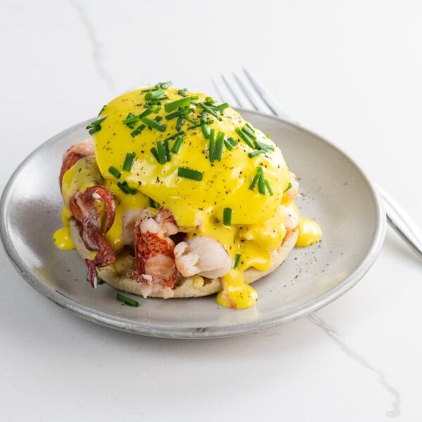 lobster benedict with immersion blender hollandaise on a small plate with a fork