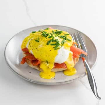 salmon benedict with immersion blender hollandaise on a small plate with a fork