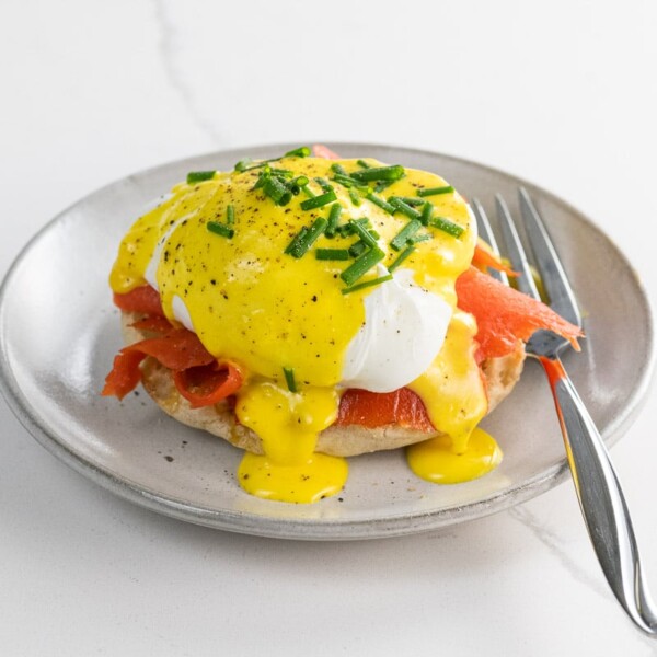 salmon benedict with immersion blender hollandaise on a small plate with a fork