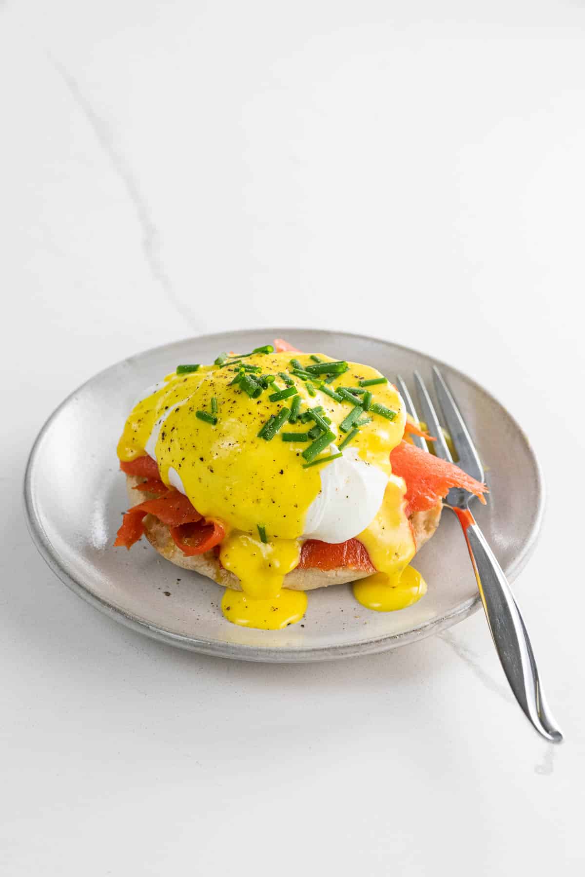 salmon benedict with immersion blender hollandaise on a small plate with a fork