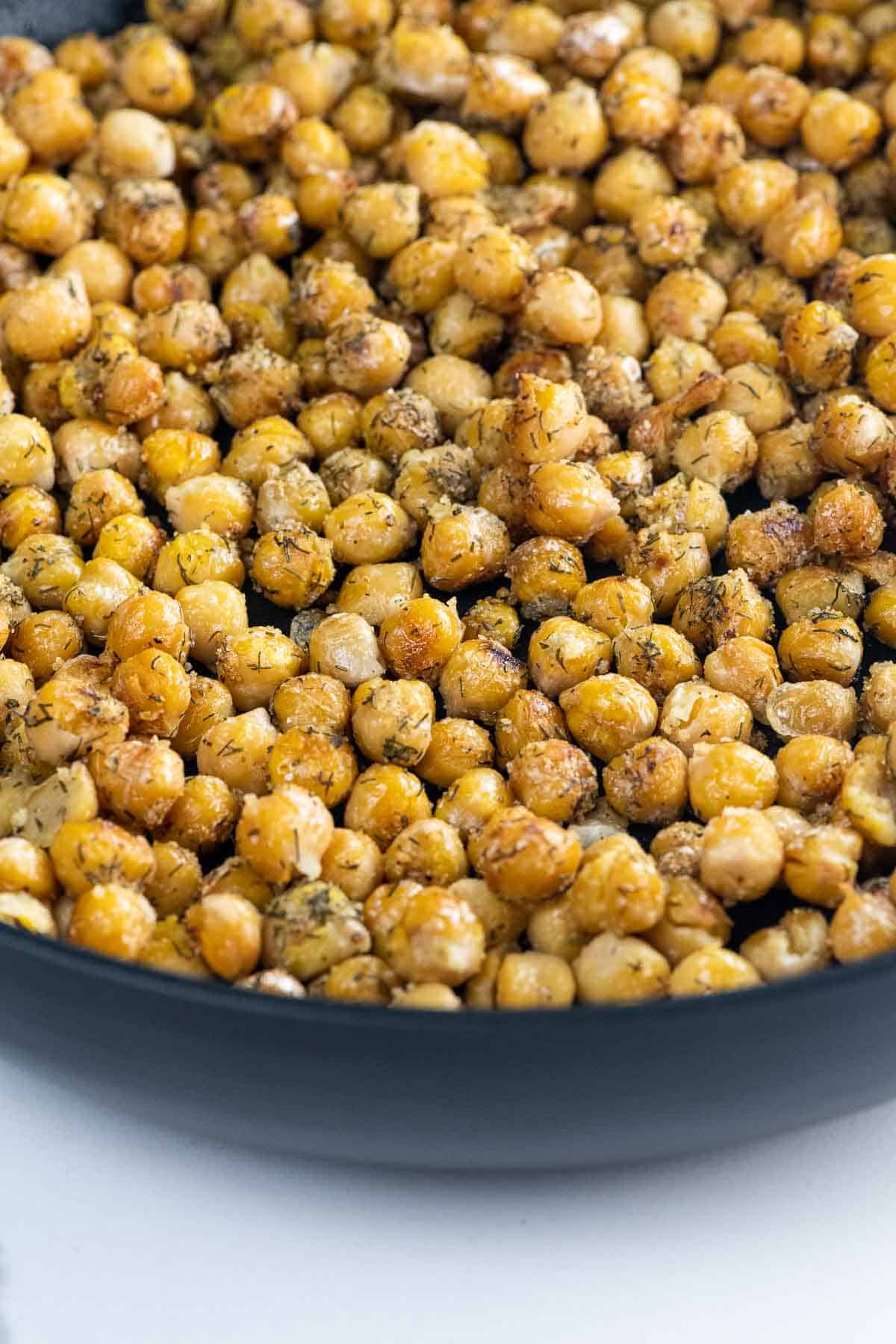 sauteed chickpeas in a frying pan