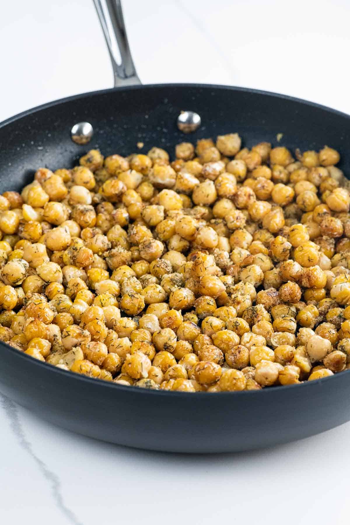 sauteed chickpeas in a frying pan