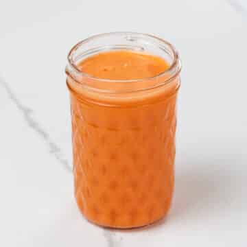 sweet potato, carrot, and orange juice in a small glass