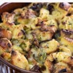 savory bread pudding with gruyere, chanterelles, and leeks in a souffle dish