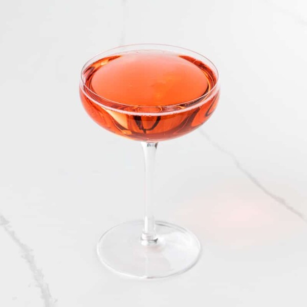 a campari prosecco cocktail (Mom's Italian soda) in a coupe glass