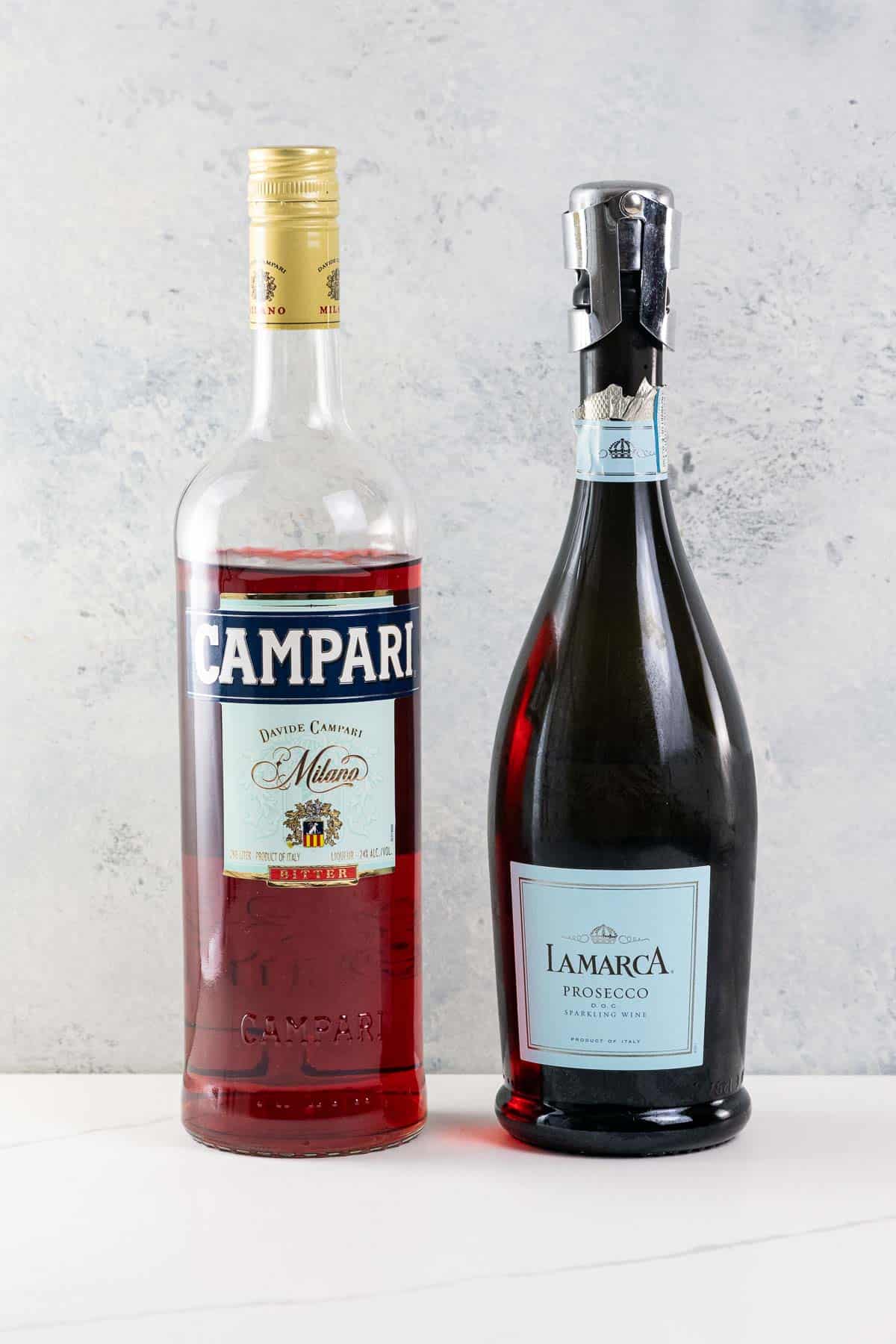 a bottle of campari and a bottle of prosecco