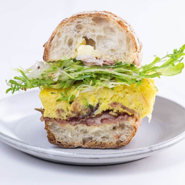 a scrambled egg sandwich on a toasted ciabatta roll