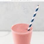 a strawberry lemonade smoothie in a glass with a straw