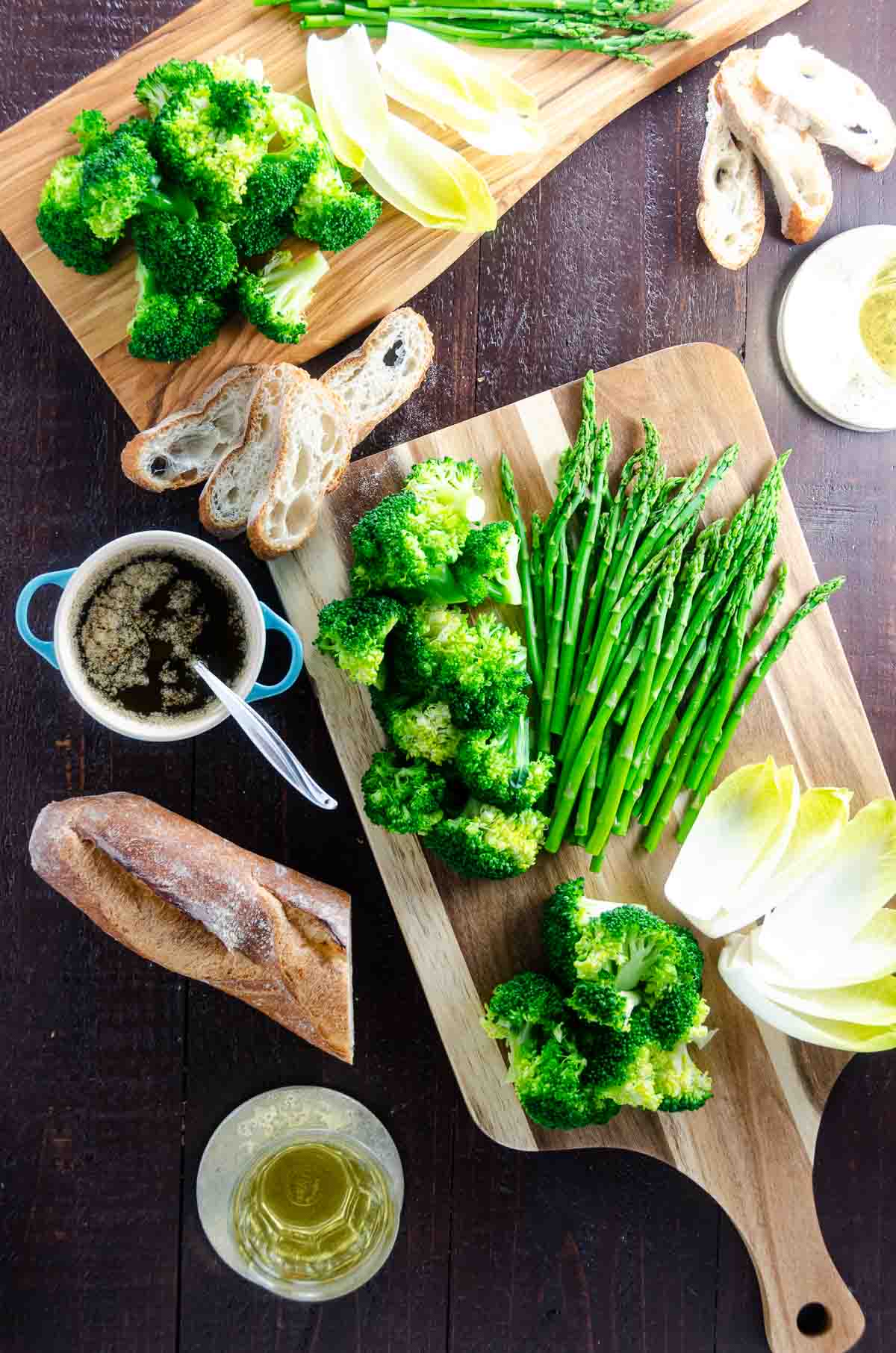 bagna cauda Piedmontese with broccoli, asparagus, baguette, endive, and white wine