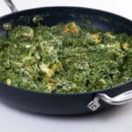 restaurant style palak paneer in a pan