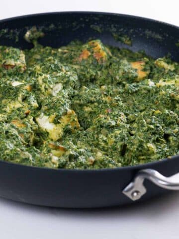 restaurant style palak paneer in a pan