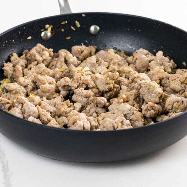 sausage pizza topping in a pan