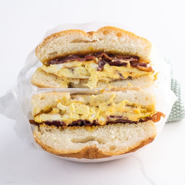a bacon egg and cheese sandwich in deli paper