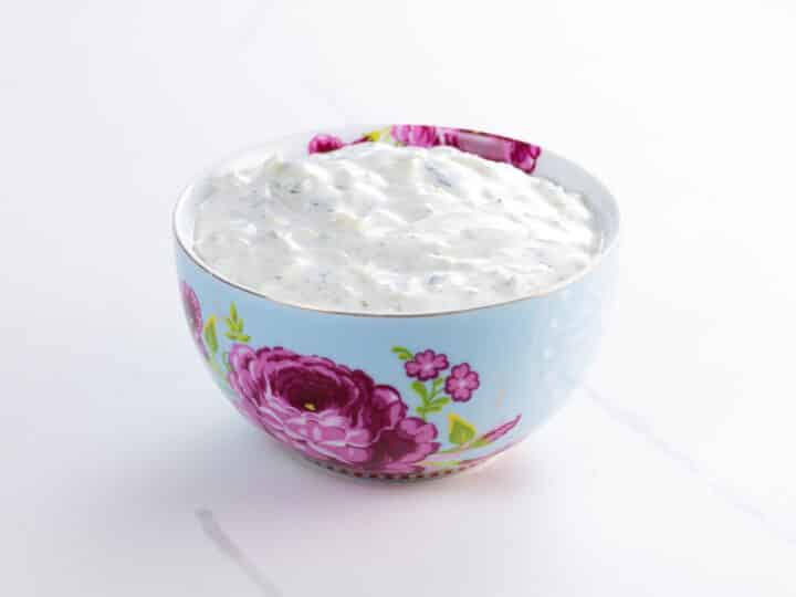 a decorative bowl containing an easy raita recipe
