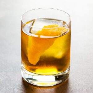 The Corduroy rye and cardamaro cocktail in a rocks glass garnished with an orange twist