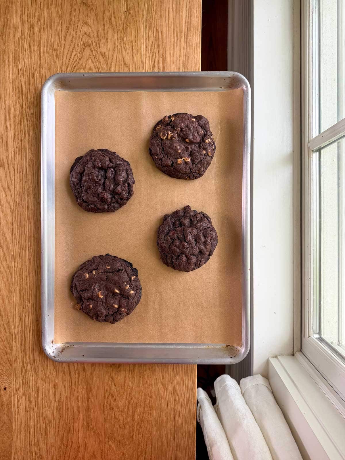 levain bakery dark chocolate cookies on a sheet pan