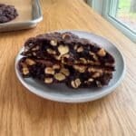 a Levain Bakery dark chocolate peanut butter chip cookie on a plate