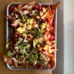 spicy tuna poke nachos on a quarter sheet pan