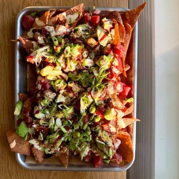 spicy tuna poke nachos on a quarter sheet pan